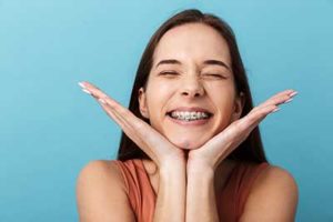 dental braces tx, girl with braces smiling