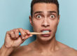 how to prevent tooth decay, man surprised brushing teeth