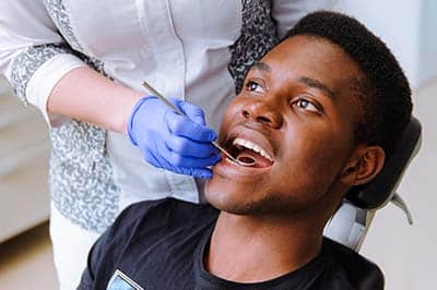 young man receiving diastema treatment