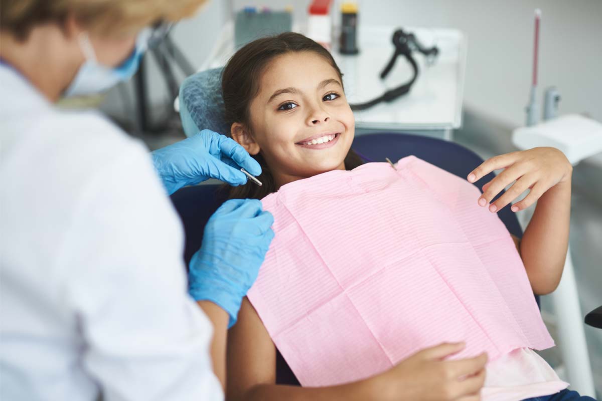 how-to-prevent-teeth-shifting (5) child getting fitted for braces to prevent teeth shifting