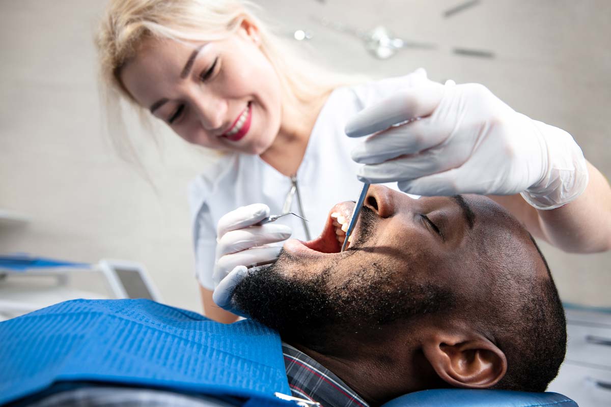 man getting dental checkups