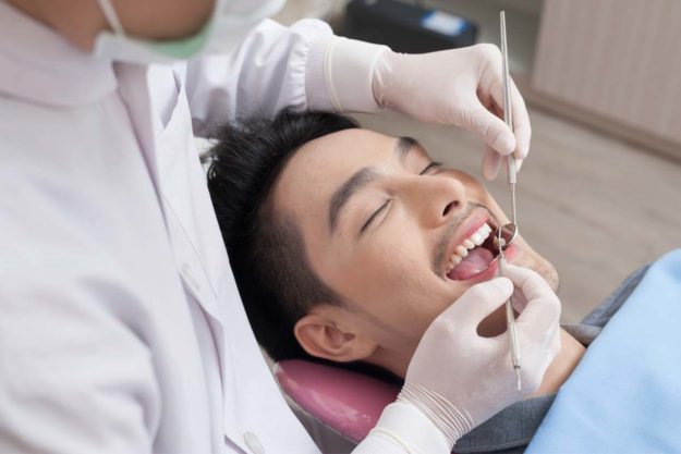 man getting dental health services
