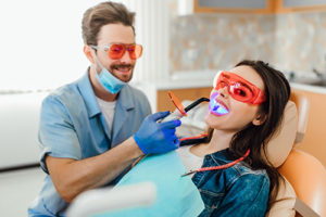 woman getting teeth whitening 