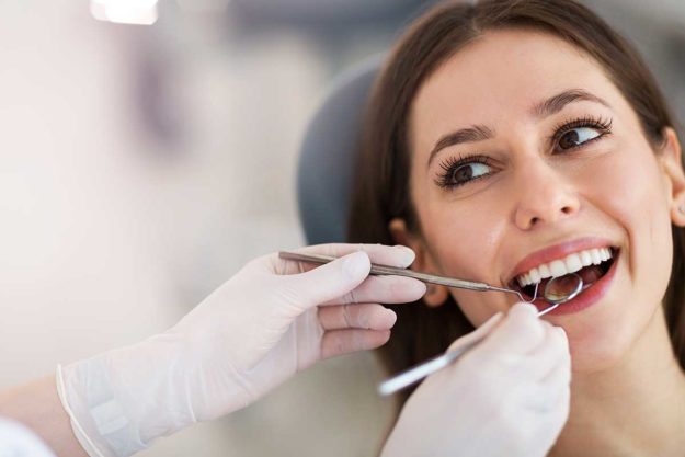 3-Benefits-of-a-Pediatric-Dentist woman learning about a pediatric dentist